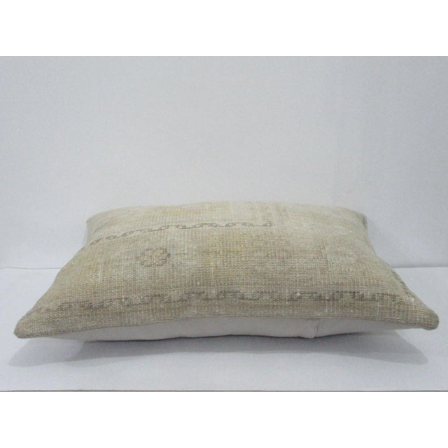 Decorative pillow cover made from a vintage Turkish handknotted rug. Backed with good quality cotton fabric. Pillow...