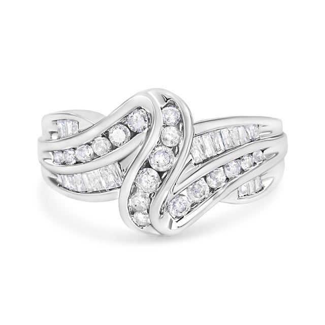 Natural diamonds and gleaming gold interlock each other to create this eye-catching bypass ring design. Created in shining...