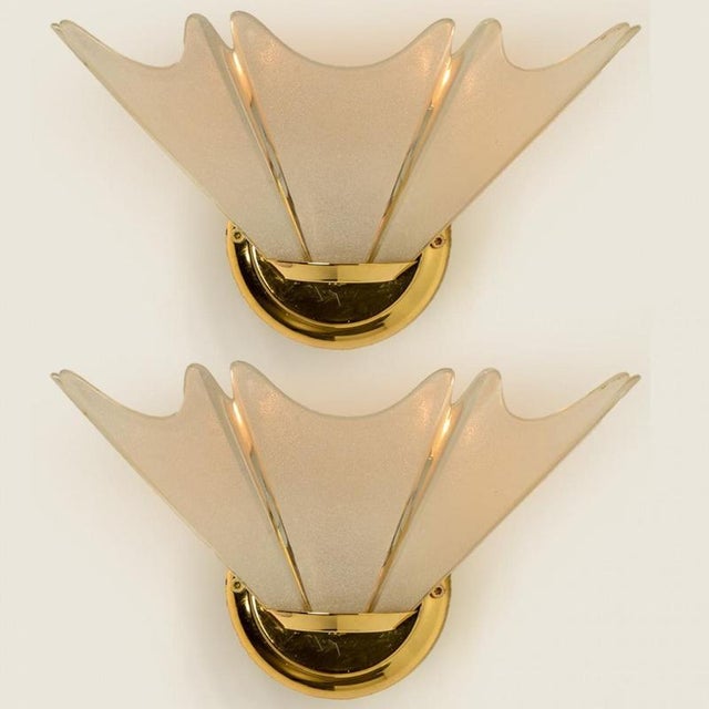 High quality modern opaline glass wall lights from Germany, circa 1970. This wall sconce features multiple hand-blown...