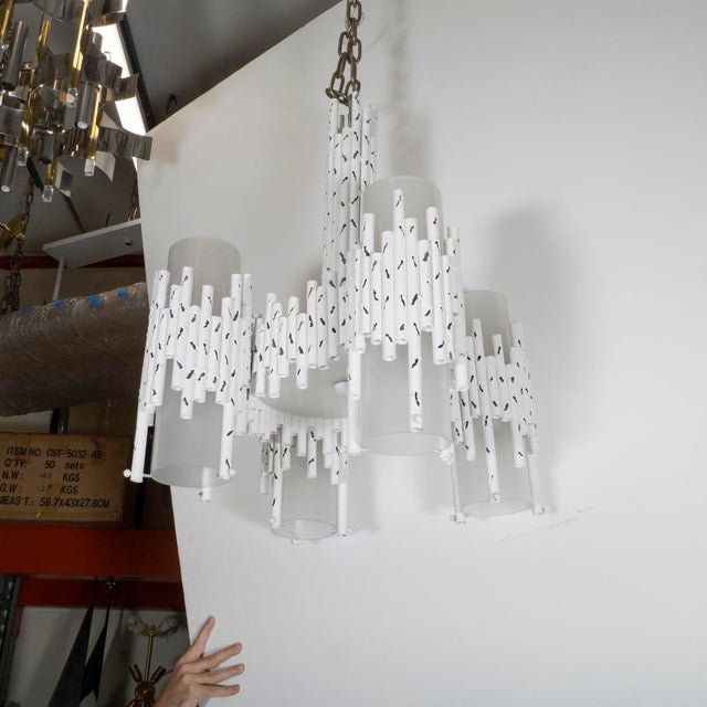 White painted brutalist style torch cut chandelier attributed to Marcello Fantoni. UL certified.