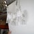 White painted brutalist style torch cut chandelier attributed to Marcello Fantoni. UL certified.