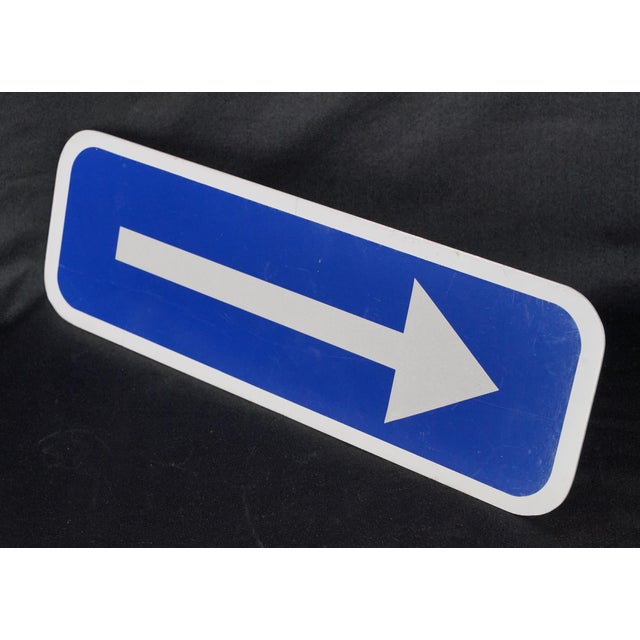 Vintage aluminum directional guide sign with a blue background and white arrow and border. Good condition with minor...
