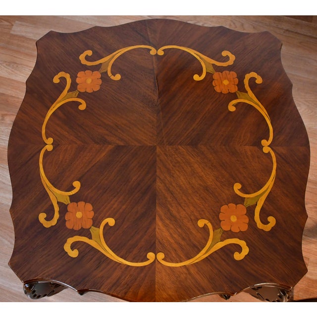 We are pleased to offer this beautiful pair of French side tables, from the 1930s. This pair is made of carved Walnut...