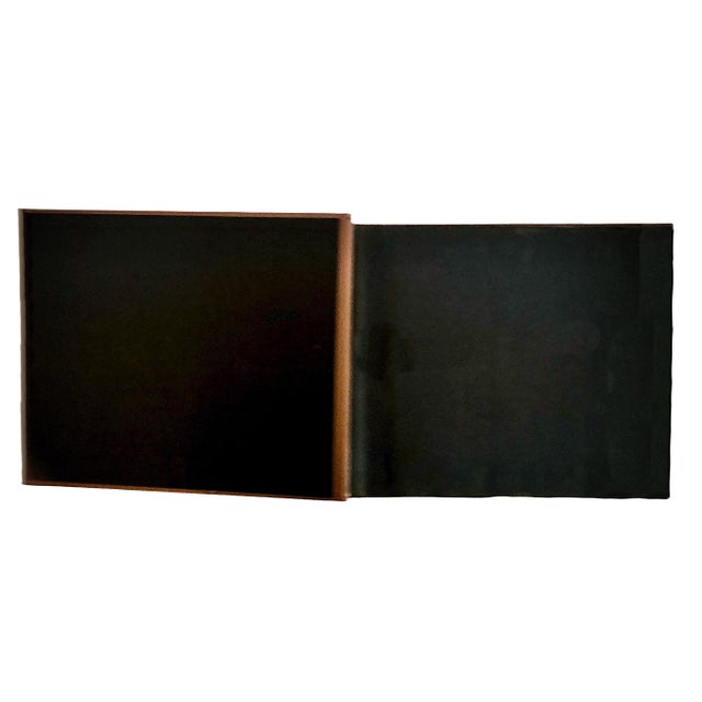 This vintage piece is a mid-20th-century travel souvenir album that documents a scenic road trip through the East Coast of...