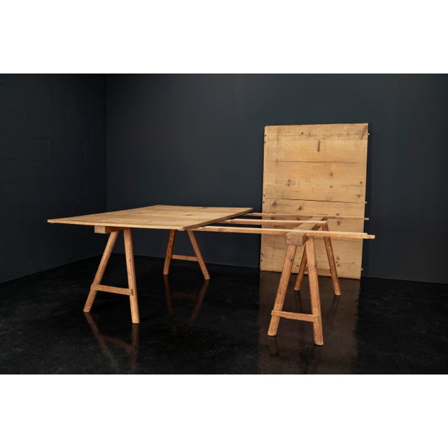 This large, modular work table dates back to the 1920s and originated in a textile workshop. The pine tabletop features...