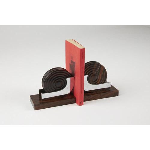 Bookends made of hardwood with turned wooden parts and chrome-plated metal components. Made in italy. Date: 1930s....