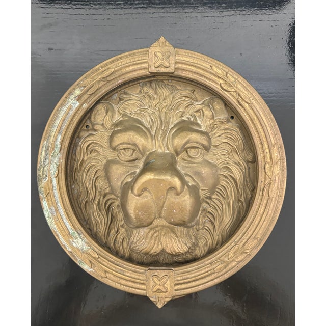 This is a superb antique door knocker similar to ones found while roaming the streets of Paris. The lion's expressive face...