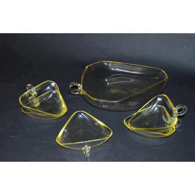 Very nice or shall I say excelent, one of a kind set of serving glassware. Main bigger cup and five smalle cups in yellow...