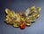 This DeLizza & Elster (Juliana) styled brooch features a distinctive mix of specialty art glass and crystal elements,...