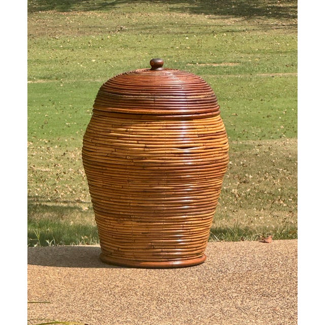 Beautiful very large mid 20th century vintage Crespi style pencil reed rattan lidded basket from the late 1960's or early...