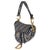Designed by John Galliano in 1999, Dior's saddle bag made its debut on the SS00 runway. The cowboy-inspired accessory has...