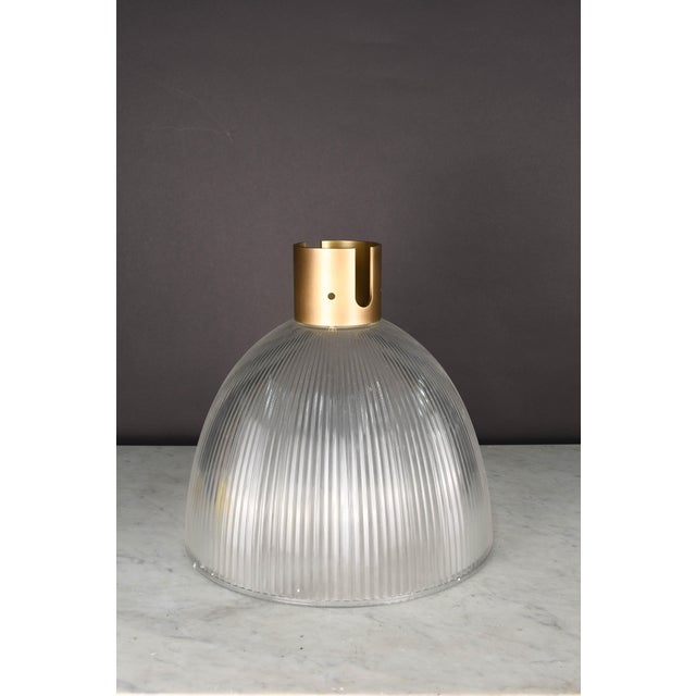 High quality craftsmanship crafted finished brass pendant with halogen glass shade. Adjustable height. Great for kitchen...