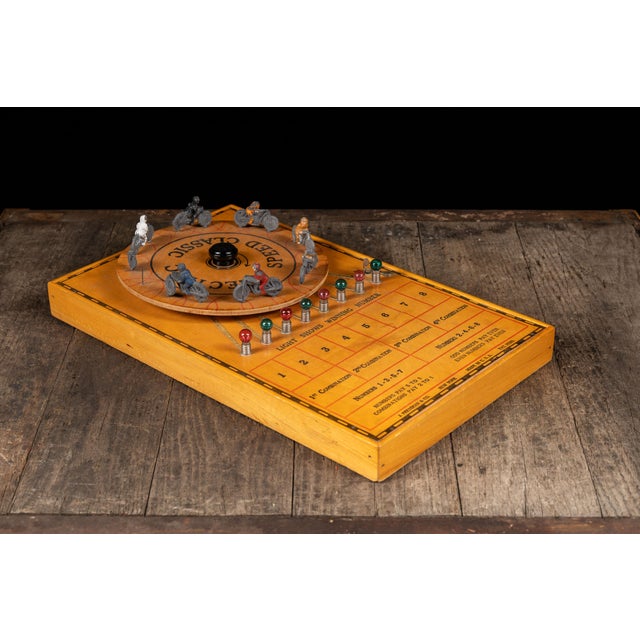 c. 1930s; J. Pressman & Co. - New York Battery-operated tabletop game of chance featuring a brightly lithographed wooden...