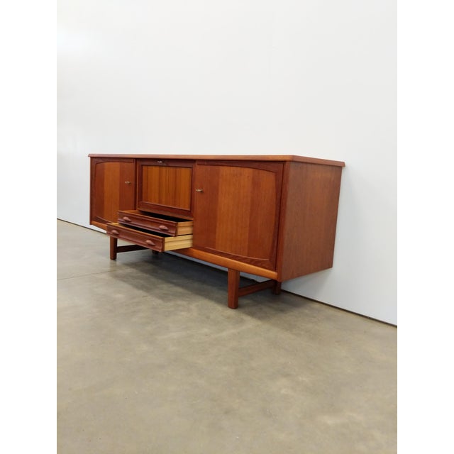 Authentic vintage mid century modern teak credenza / sideboard / console. This piece is in excellent condition with very...