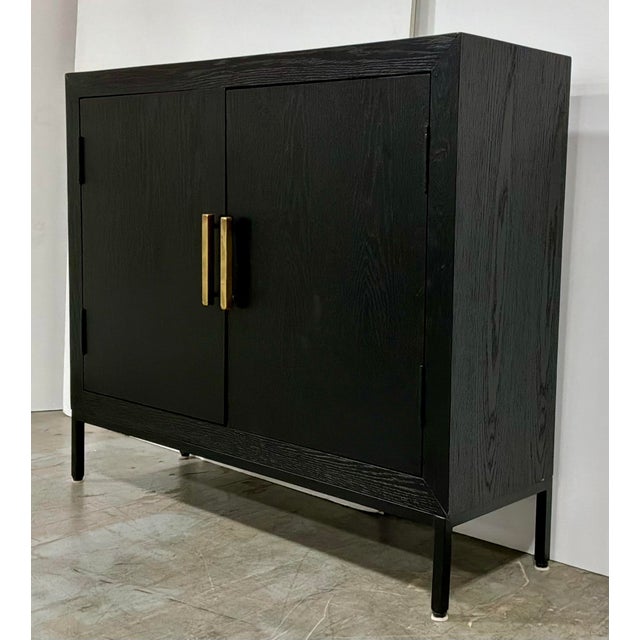 Stylish Uttermost Modern Two Door Black Wood Cabinet, gold pulls, showroom floor sample