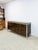 This extraordinary Tomlinson mid-century modern burlwood credenza is a rare and highly collectible vintage statement...