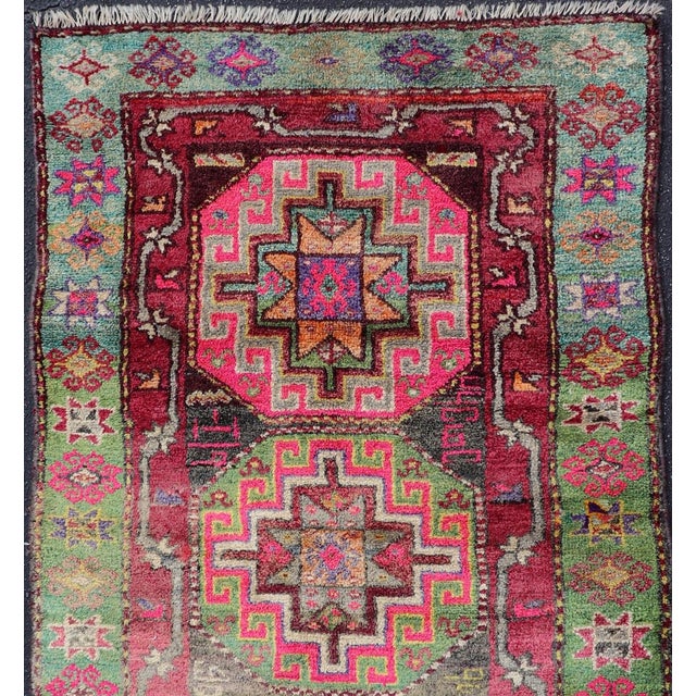 Measures: 3'10 x 7'0 Vintage Caucasian Kazak Rug with Triple Medallions in Pink and Green 3'10 x 7'0. Keivan Woven Arts/...