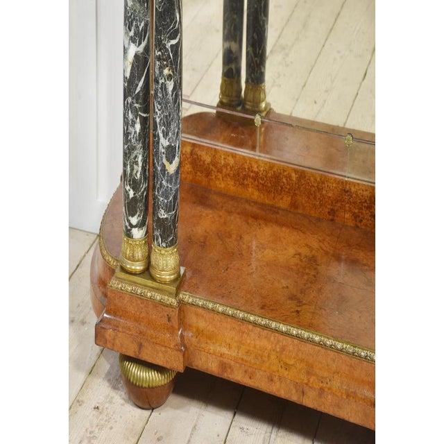 Superior quality Louis XV-style walnut console table. The large green veined marble top above the large central freeze...