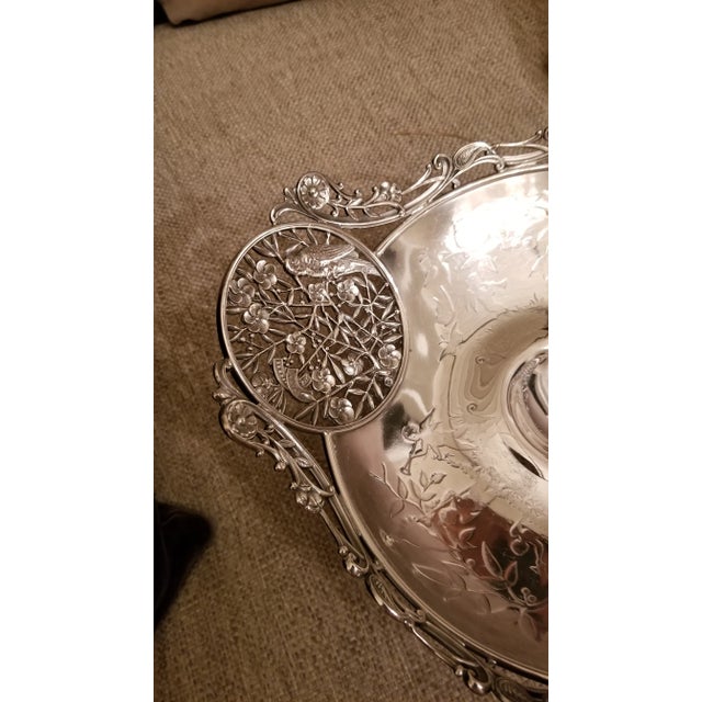 Charming antique silver plated basket with handle and two pierced medallions on each side in the japanesque style. Stamped...