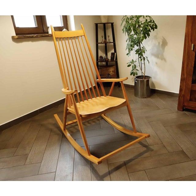 Vintage rocking chair by Finnish brand Varjosen Puunjalostus from the 1960s. Made of solid wood with elegant bent lines...