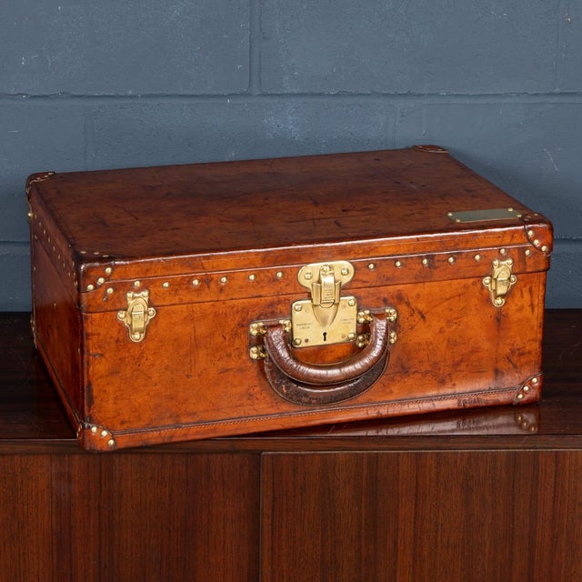 A rare and highly evocative early 20th-century louis vuitton fitted leather travelling case, retaining its original brass...