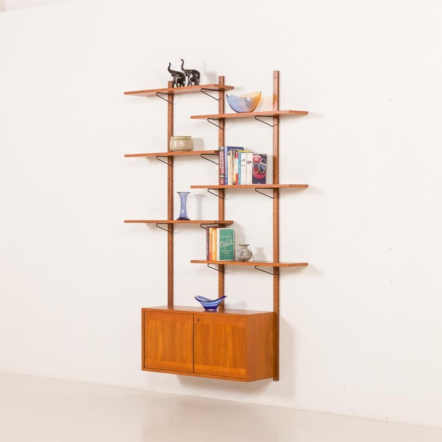 This scandinavian vintage teak wall unit was probably made in denmark some time in the 1970s. overall dimensions are h:...