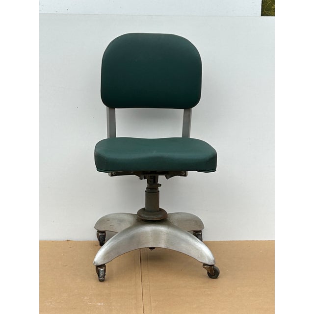 **Description:** Authentic 1951 mid-century industrial tanker desk chair manufactured by the General Fireproofing Company...