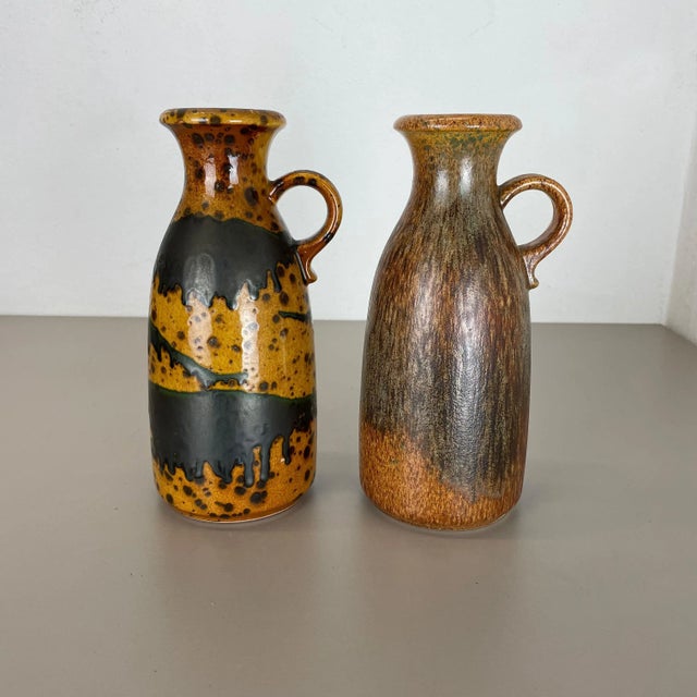 Set of two fat lava art vases Producer: Scheurich, Germany Decade: 1970s These original vintage vases was produced in the...