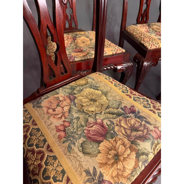 An elegant antique Chippendale-style side chair showcasing the exceptional craftsmanship and decorative details that have...