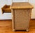 Vintage 1970s wicker and rattan nightstand with one drawer and one open shelf. Made with a woven wicker body and rattan...