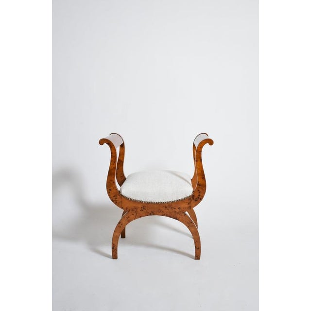 Pair of walnut curule stools, XIXth. Pair of neoclassical walnut and walnut root veneer curule chairs stools, with curved...