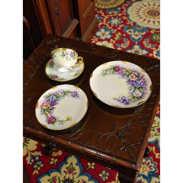 The Vintage Plankenhammer Floss Bavaria Painted Pansies Porcelain 4piece Tea Set is a charming and collectible tea set...