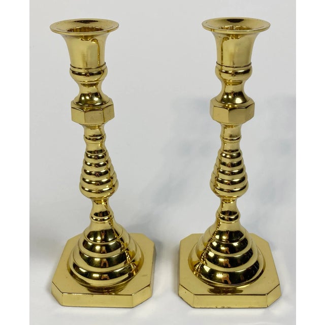 Vintage beautifully polished classic brass candlestick holders with an elegant inverted beehive form. Made by Hampton....
