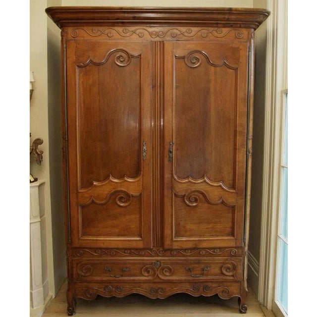 Epoque Louis XV walnut armoire from Chateau de Chevre Chatelard. (near the castle of La Rochefoucauld).