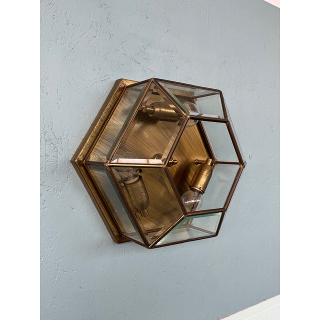Vintage ceiling or wall lamp featuring a classic hexagonal shape and a brass frame with beveled glass panels. The design...