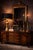 A sculptural vintage brass lamp reimagined in a warm sunlit finish, paired with a dramatic black drum shade with gold...