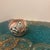 An exquisite mid-to-late 20th-century miniature polychrome pottery jar crafted in the tradition of the Acoma Pueblo (Sky...