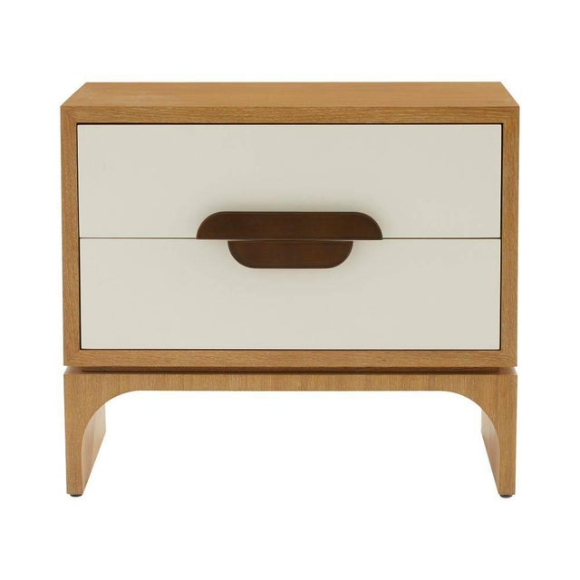 We adapted our classic Kianna credenza in a smaller size to perfectly pair with a bed or sofa. A white lacquer face is set...