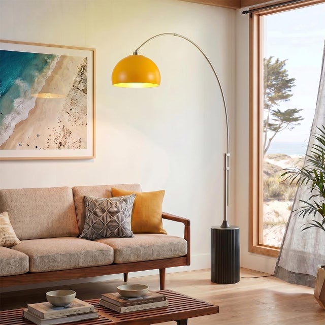 The Tambo Arc Lamp is a striking Mid-Century Modern lighting piece designed by Peter Morelli in 1984. This arc lamp...
