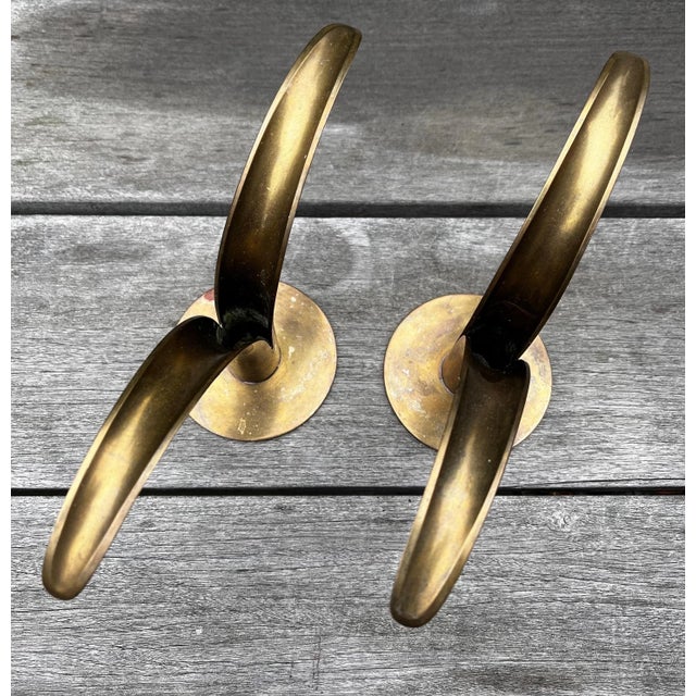 Pair of Mid-Century Modern brass candleholders by Ivar Alenius Bjork for Ystad Metal. Made in Sweden circa 1950s. Labeled...