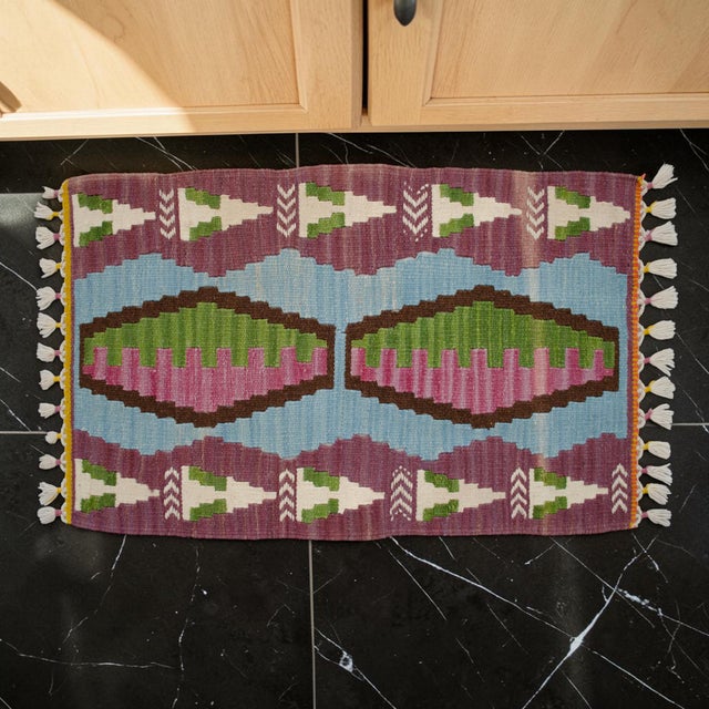 Embrace the genuine nomadic soul and flat-weave aesthetic with this authentic Anatolian textile. Its striking geometric...