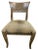 Elegant carved dining set featuring a round glass-top table and four matching upholstered chairs. The table base and chair...