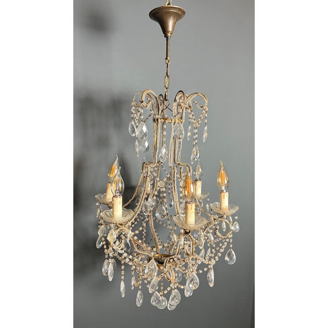 This beautiful chandelier is made of pearls and crystal. It is an Italian work. Circa 1970