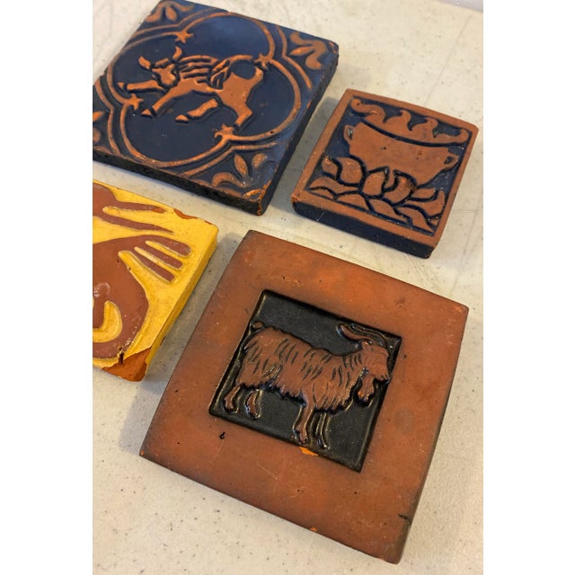 Four Vintage Bucks County Tiles Various vintage tiles Approximately 4" x 4" each The yellow tile is a bit smaller and...