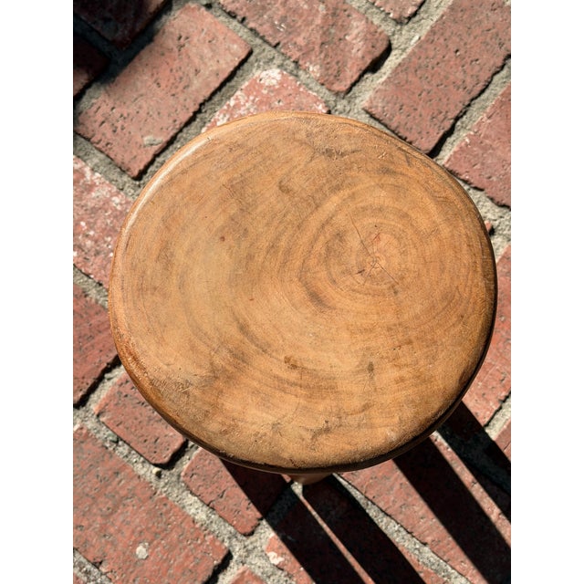 This vintage African wooden Senufo stool is a unique and handmade piece that reflects the rich cultural heritage of West...