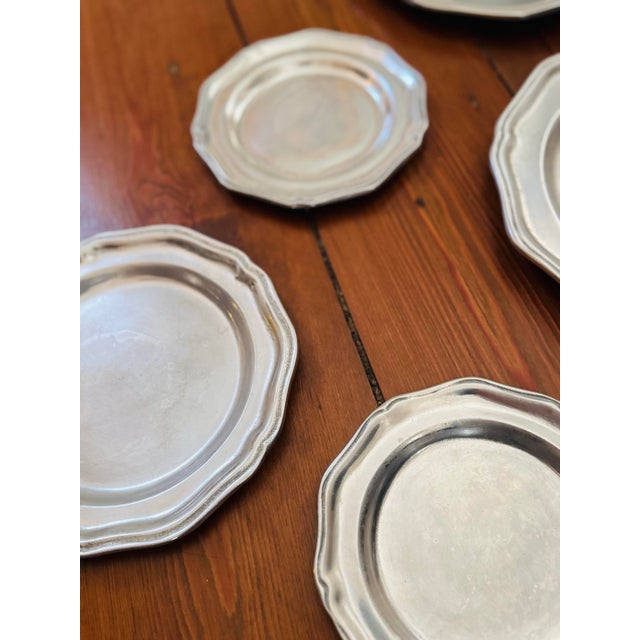 Pewter plate wall?! Yes, please! Timeless and dependable. Three plates measuring 8.75 inches. Four plates measuring a...