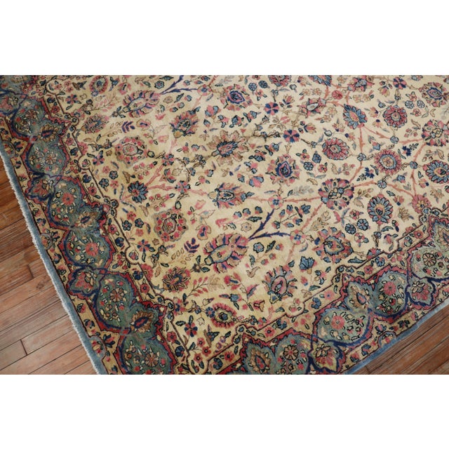 An early 20th century Kerman rug with a floral design on an ivory field in a rare 6 x 9 size. They typically made these in...