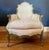 19th century gilt Louis XV Bergere chair with updated, double welted, down filled uoholstery. Ornately carved serpentine...
