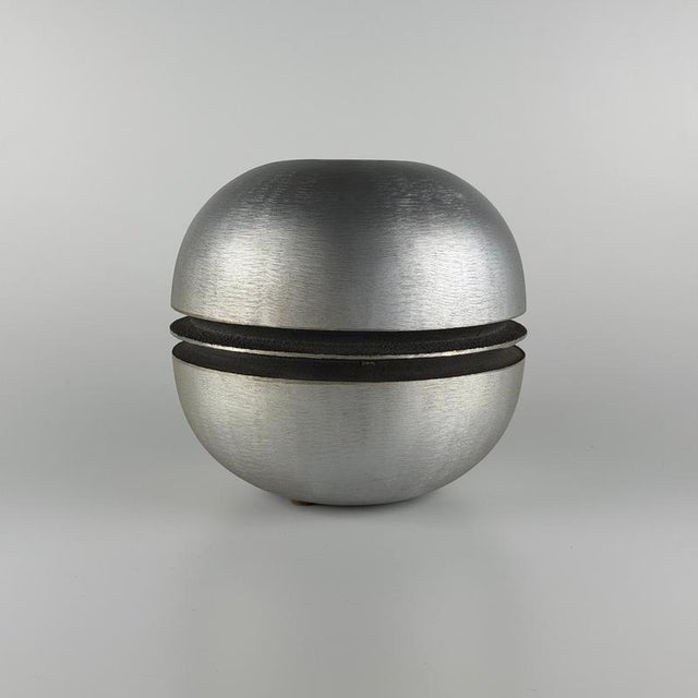 A striking large vase-sculpture by Burchiellaro, Italy, 1970s, crafted in cast iron and aluminum. with its sculptural...