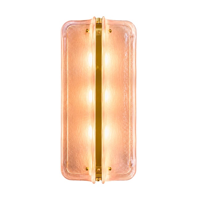 A refined Italian design wall sconce conceived as a sculptural lighting statement, blending mid-century modern aesthetics...